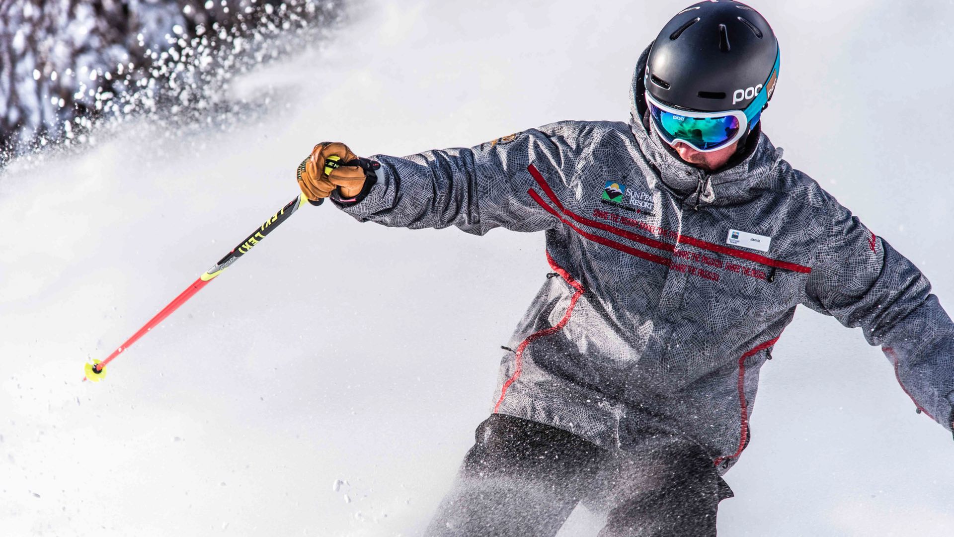 Ski Instructor Arm Out Amid Snow Spray