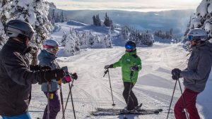 Ski Instructor Talking to 3 Students on Piste